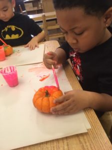 painting a pumpkin at Head Start