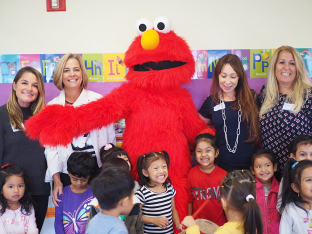 Members of IICF with Woodside Head Start/EarlyLearn students and Elmo