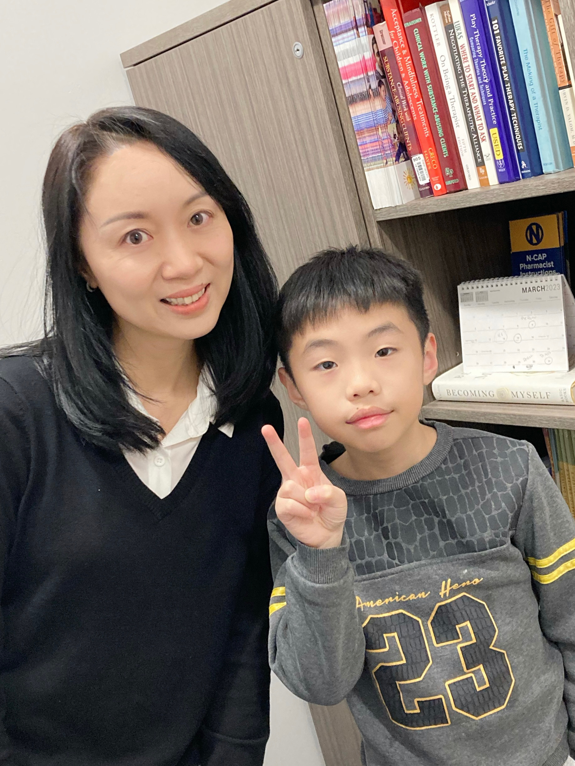 Clinical Intern Wing-Wah Wong and 8-year-old client Junming