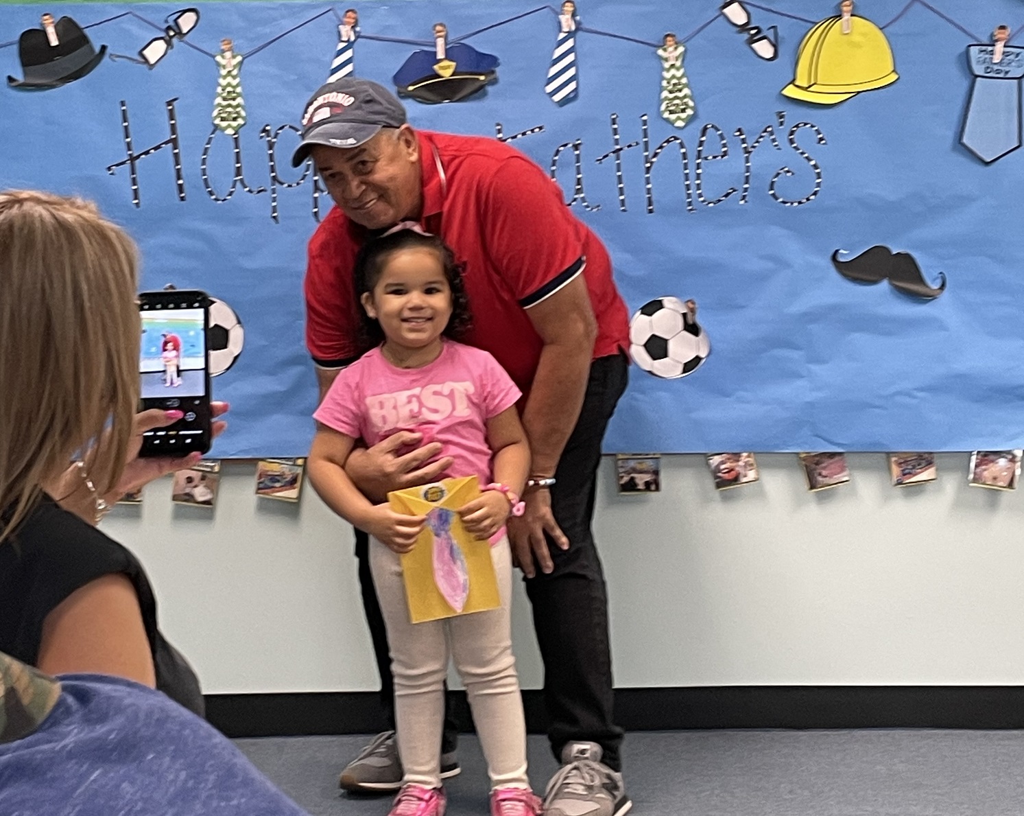 Jazlyn and her dad at the Father's Day celebration at Corona Head Start in Corona, Queens