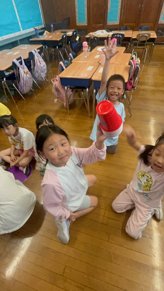 Participants of Literacy Leaders at COMPASS at P.S. 24 in Flushing build a literacy tower to beat the summer slide.