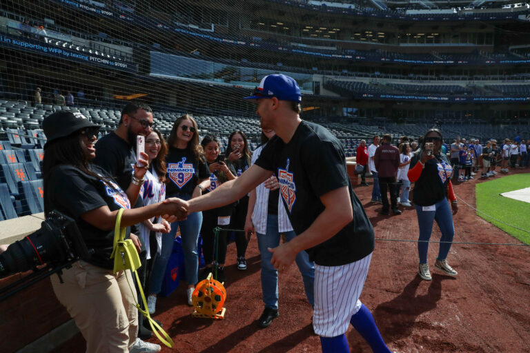 NY Mets outfielder Brandon Nimmo shakes hands with Child Center of NY staff of the Cohen Family Wellness Center.
