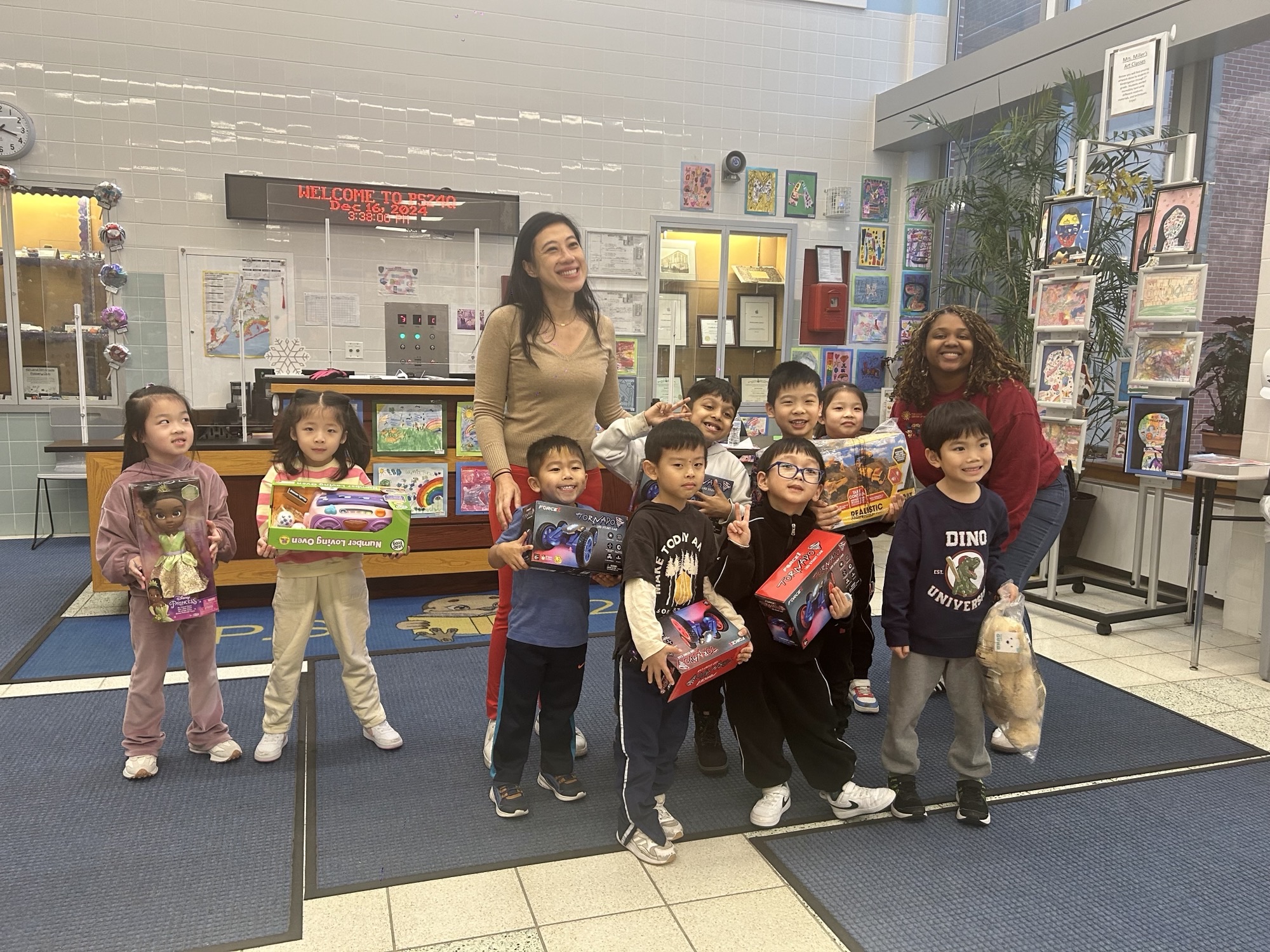 Council Member Sandra Ung poses with T'yana Coutrier, program director, and students of The Child Center of NY's COMPASS program at P.S. 24Q in Flushing, Queens