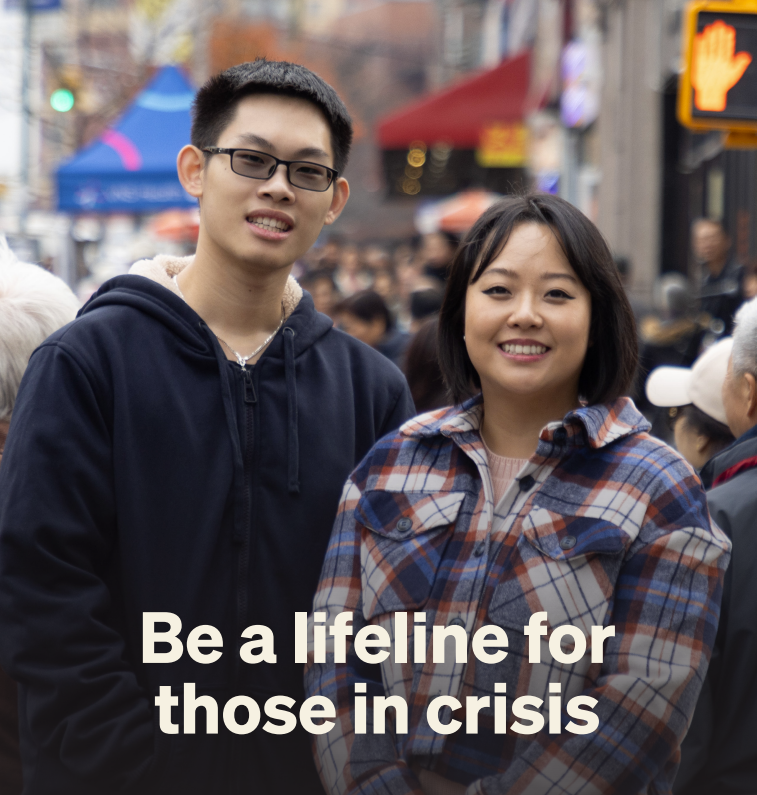 A photo of Nara and Jin posing on a busy sidewalk with the words, "Be a lifeline for those in crisis," used in Robin Hood's Faces of Poverty Fighters campaign