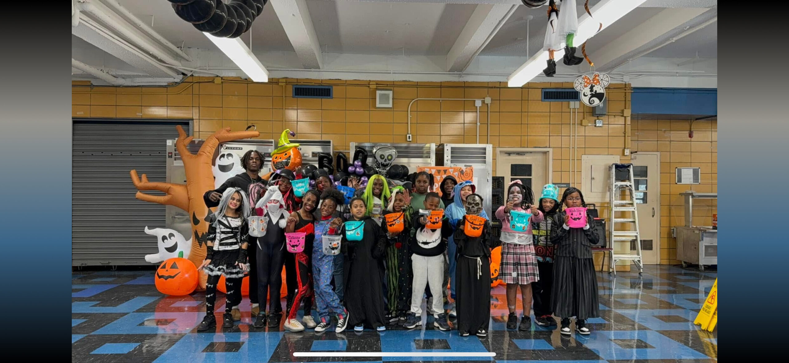 Group photo of AJ and Cornerstone Community Center participants in costume for Halloween.