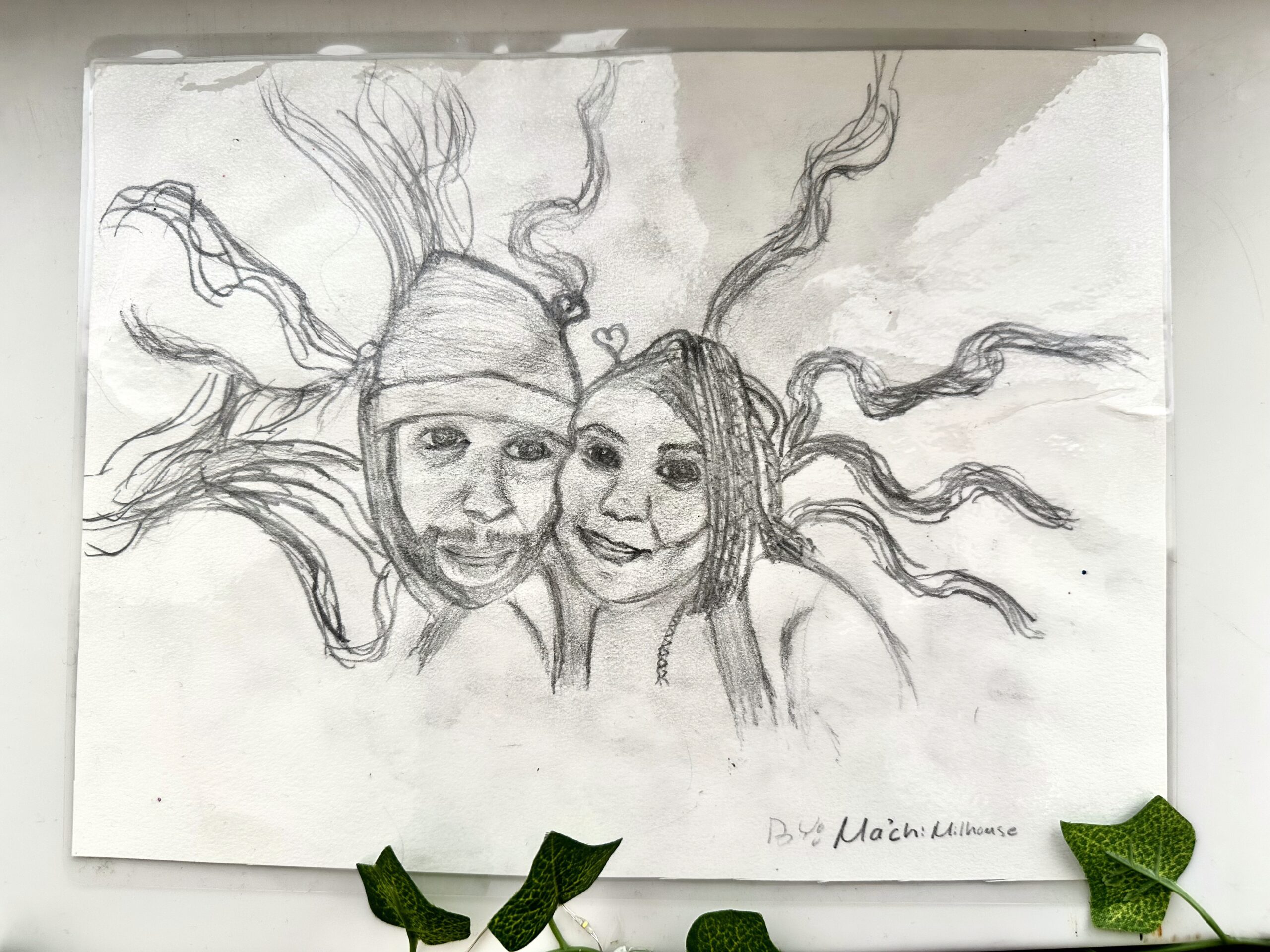 A pencil drawing of Ma'Chi's mom and stepfather.